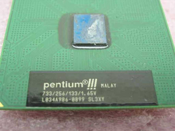 Intel Pentium III SL3XY processor label close-up showing 733/256/133/1.65V spec markings and sSpec SL3XY