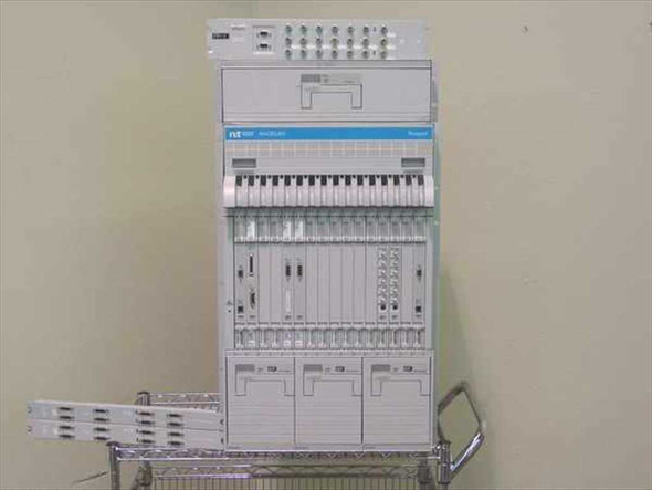 Nortel Passport 6480 Magellan multiservice edge switch system front view with installed cards and panels on wire cart
