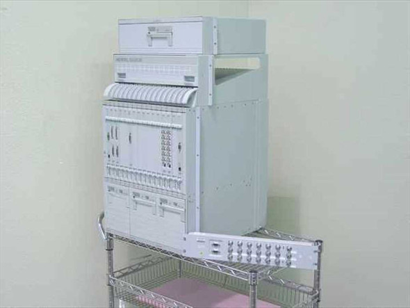 Nortel Passport 6480 multiservice edge switch system left-side angle view showing chassis height and card density