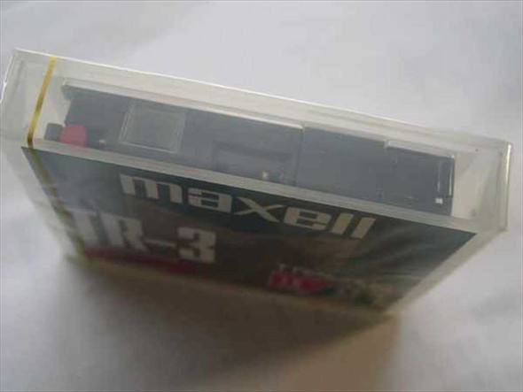 Maxell TR-3 Travan Mini Cartridge side view showing cartridge mechanism inside clear plastic case