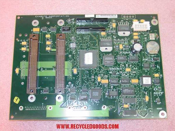 Exabyte 785400-A03 backplane PCB top side showing large central controller IC, dual edge connectors, and populated component array — front view