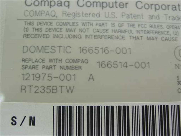 Compaq keyboard bottom label showing part numbers 166514-001, 121975-001, RT235BTW and FCC compliance information