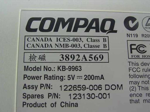 Compaq KB-9963 bottom label showing model number, part number 123130-001, assembly P/N 122659-006, and 5V 200mA power rating