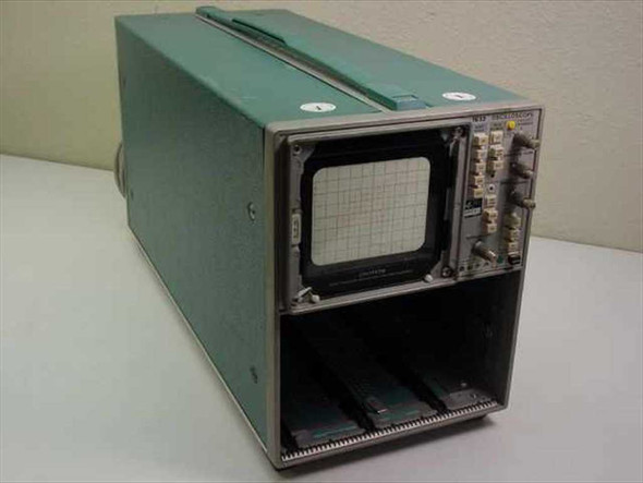 Tektronix 7633 analog storage oscilloscope mainframe chassis — three-quarter front-left view showing CRT display and three plug-in bays with plug-in modules installed