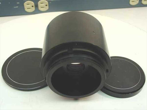 General Electric GE 4.2:1 Light Valve Projector Lens – front element exposed with two lens caps laid aside