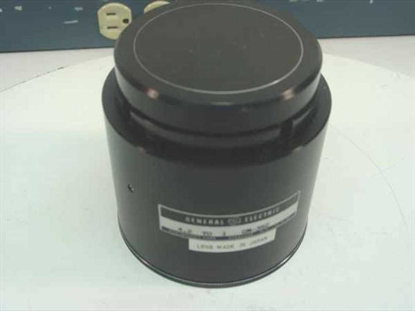 General Electric GE GM-392 4.2:1 Light Valve Projector Lens – front view with lens cap on, GE label visible on barrel
