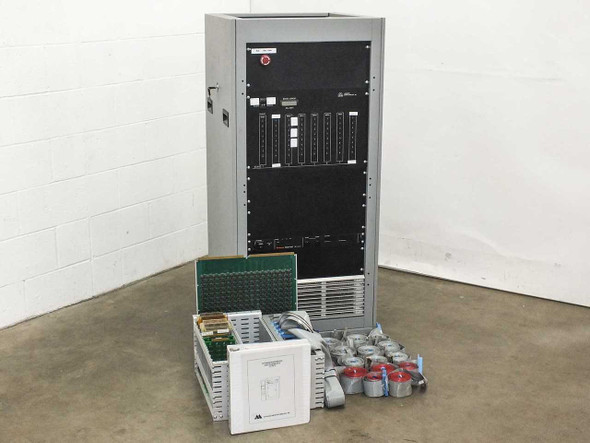 Advanced Microtechnology rack mount burn-in system full front view with floor cabinet and loose PCBs and accessories laid out in front