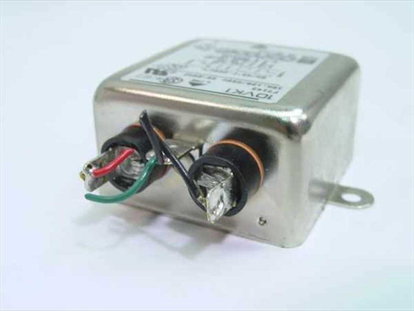 Corcom F7143 10VK1 EMI filter – angled view showing wire leads and LOAD terminals