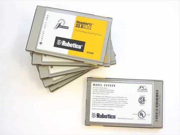 US Robotics Megahertz CC4336 PCMCIA modem lot with one card flipped to show rear label — MODEL CC4336, UL listing, PC Card certification mark visible