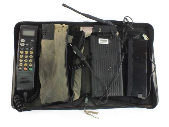 Motorola SCN2449A vintage 1990s analog car phone open in travel bag showing handset, battery, charger, and accessories