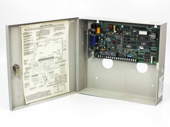 Digital Monitoring Products 1912 Command Processor – open wall enclosure showing circuit board and wiring diagram inside door