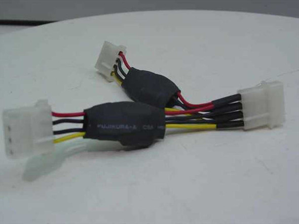 Two 4-pin Molex Y splitter cables side by side showing Fujikura branding on ferrite chokes, white connectors, and red, yellow, and black wiring