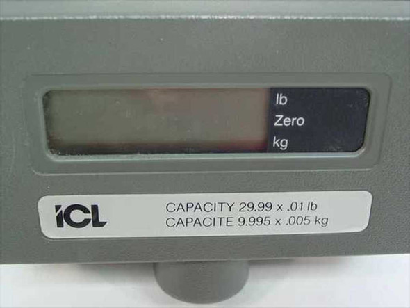 ICL 310RD scale display close-up of front panel label showing capacity 29.99x.01 lb and 9.995x.005 kg with LCD display