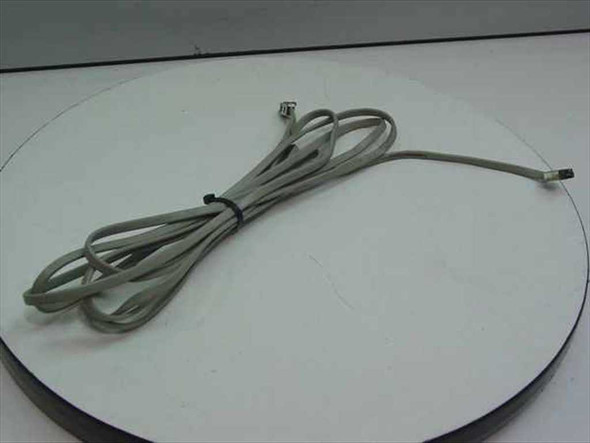 IBM 6316832 cash register cable coiled on white surface, full length view