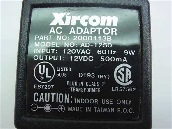 Xircom AC Adaptor label showing Part No. 2000113B, Model AD-1250, Input 120VAC 60Hz 9W, Output 12VDC 500mA, UL and CSA markings
