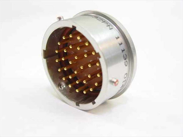 Deutsch 46099-18-32 1139 connector — angled side view showing aluminum shell body, brown dielectric insert, and gold pin contacts protruding from face