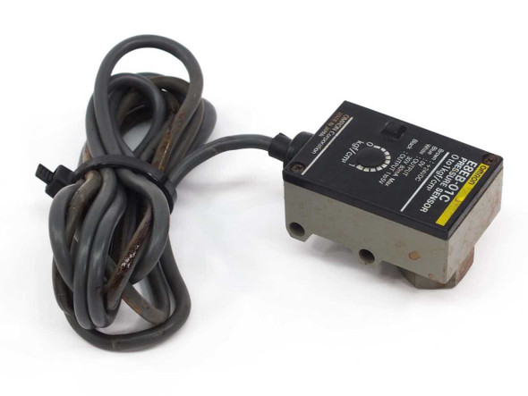 Omron E8EB-01C pressure sensor rear-left view showing label, rotary adjustment dial, and cable