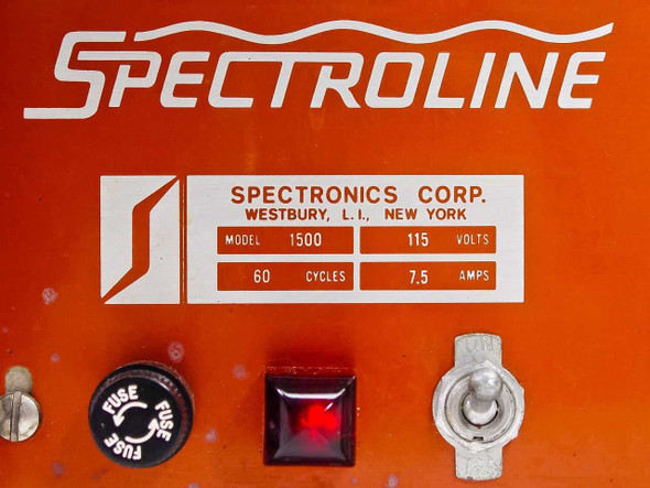 Spectroline 1500 rating plate closeup — Spectronics Corp Westbury NY label showing Model 1500, 115 Volts, 60 Cycles, 7.5 Amps; fuse holder and red power indicator visible