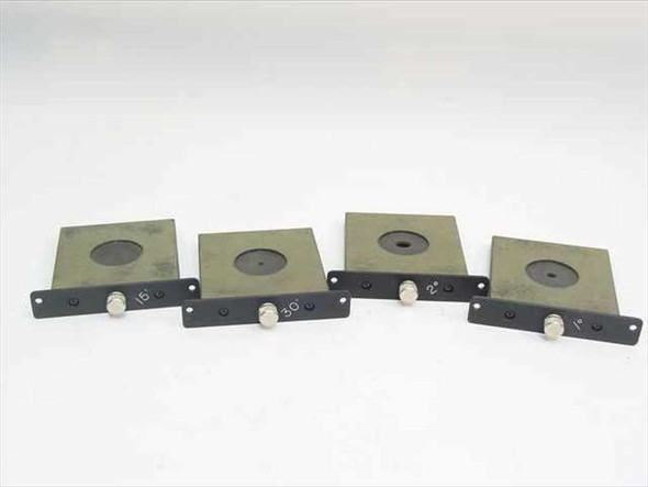 Set of four aperture inserts front view showing black anodized plates with circular aperture openings and degree markings on the mounting brackets