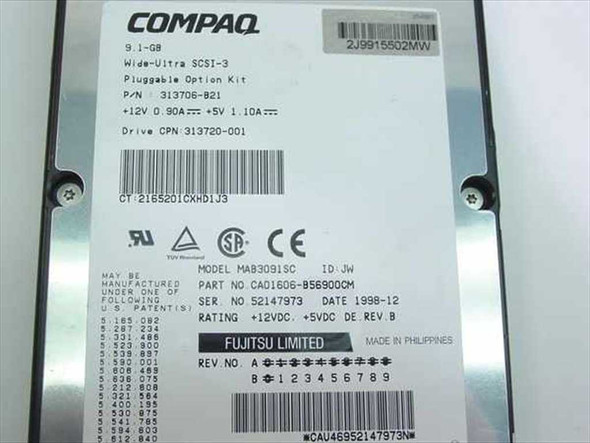Compaq 313720-001 side label showing Fujitsu MAB3091SC model, part number CAD1606-B569000CM, serial number, and 1998-12 date code