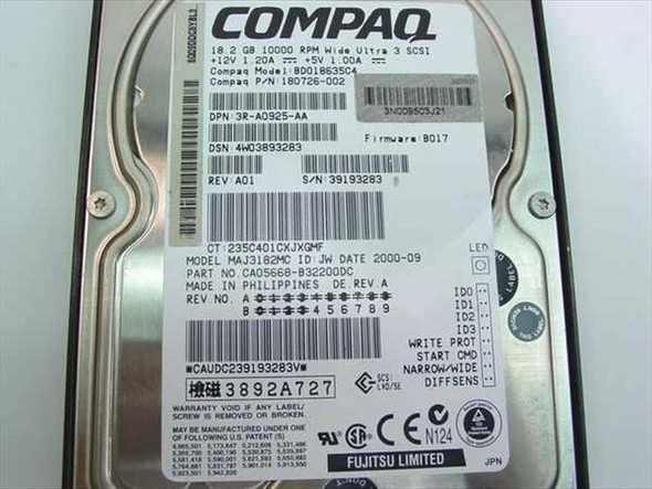 Compaq 180726-002 drive label close-up showing 18.2GB 10000 RPM Wide Ultra 3 SCSI specs, Fujitsu MAJ3182MC model, voltages, firmware B017, date code, and Philippines manufacture