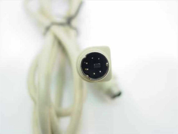 Close-up of PS/2 6-pin mini-DIN male connector showing pin arrangement and molded housing