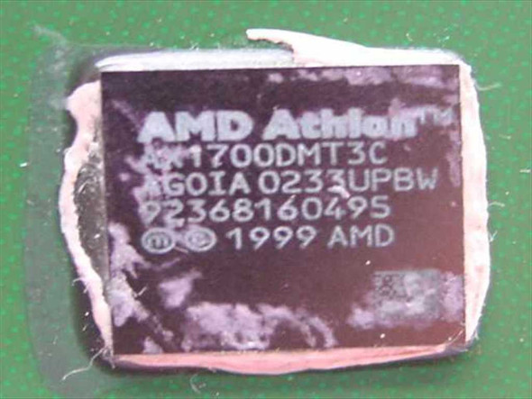 AMD Athlon XP 1700+ AX1700DMT3C processor label closeup showing part number AGOIA 0233UPBW, serial 92368160495, 1999 AMD