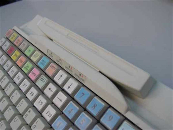 Preh Commander MC128WX POS keyboard — close-up of top edge showing card reader slot area and function key row with colored caps