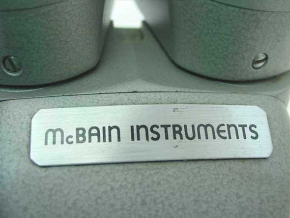 McBain Instruments brushed metal nameplate closeup on binocular stereo microscope head