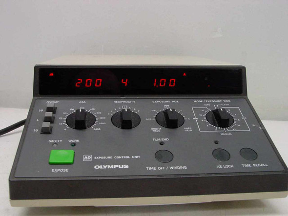 Olympus PM-CBAD Exposure Control Unit – close-up of front panel controls including LED readout, rotary knobs for ASA and reciprocity, Film End indicator, AE Lock and Time Recall buttons, and Time Off/Winding control