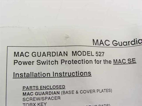 MAC Guardian Model 527 installation instructions sheet showing product name, model number, and parts enclosed list including base and cover plates, screw/spacer, and Torx key