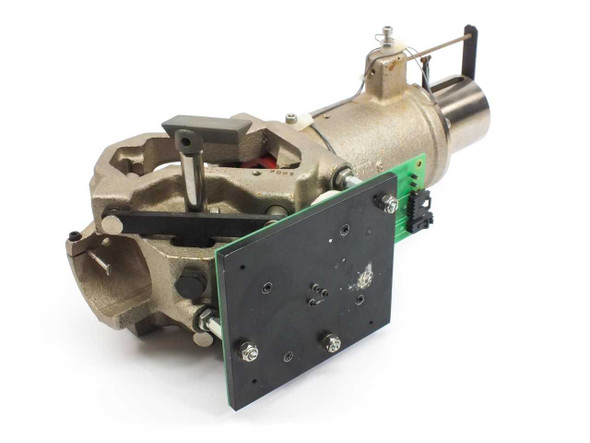 Nicolet Magna 000-869102 Magnum End Plate Board 410-110300 — front-left three-quarter view showing cast metal housing and attached green PCB