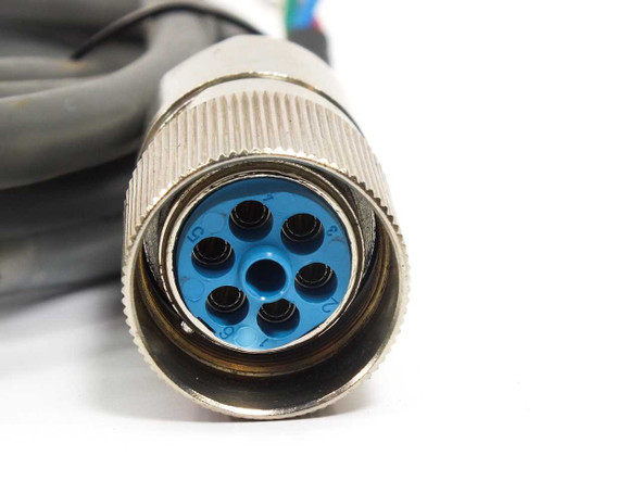Close-up of 7-pin circular metal connector face on Yaskawa B4ICE-03A servo power cable with blue insert