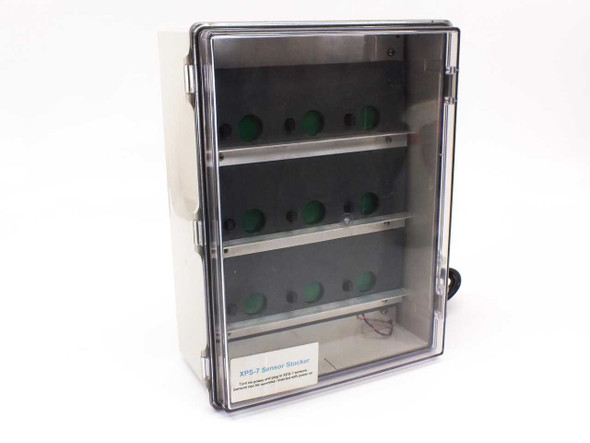 Cosmos XPS-7 Sensor Stocker front view with clear hinged door closed showing 9 green sensor slots across three shelves