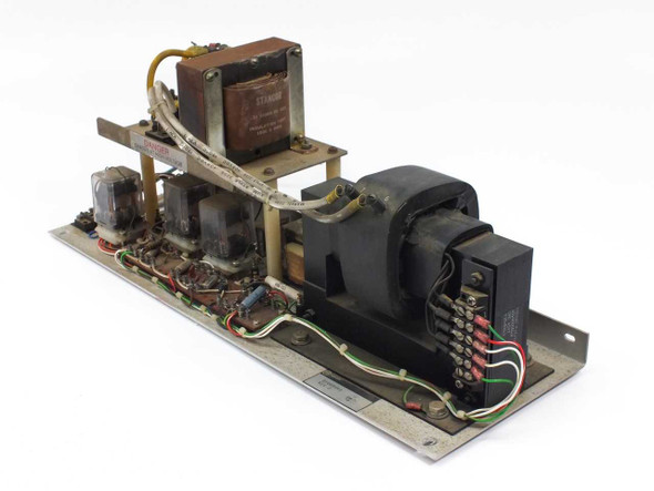 Varian CMC 1527A High Voltage Power Assembly – three-quarter view showing large HV transformer, Stancor transformer, relays, and wiring on aluminum chassis