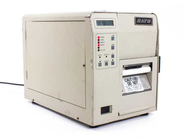 SATO M-8400 Industrial Barcode Label Printer front-right three-quarter view showing LCD display panel, indicator LEDs, and label exit slot with caution tag