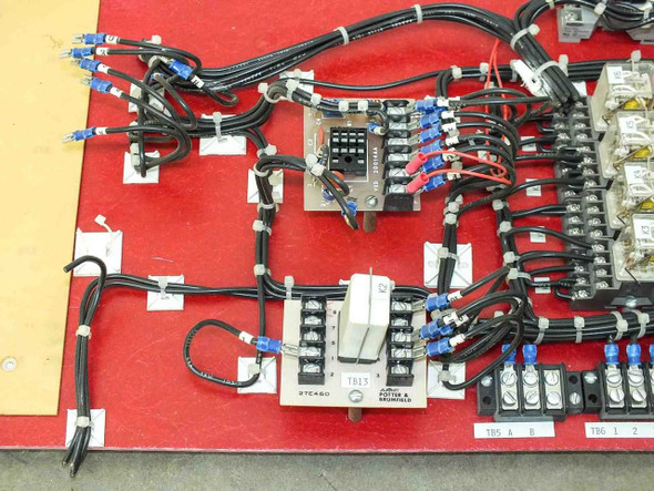 Volkmann drive control panel – close-up of left wiring section showing Potter & Brumfield relay, terminal blocks labeled TB13, and multi-conductor cable harness on red backplane