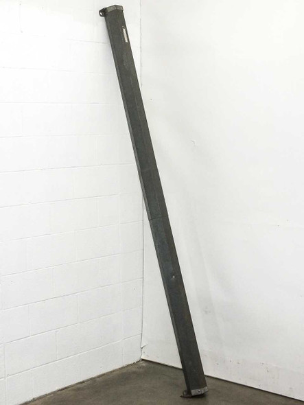 Da-Lite Model C projection screen housing leaning against wall, showing full length of steel roller case