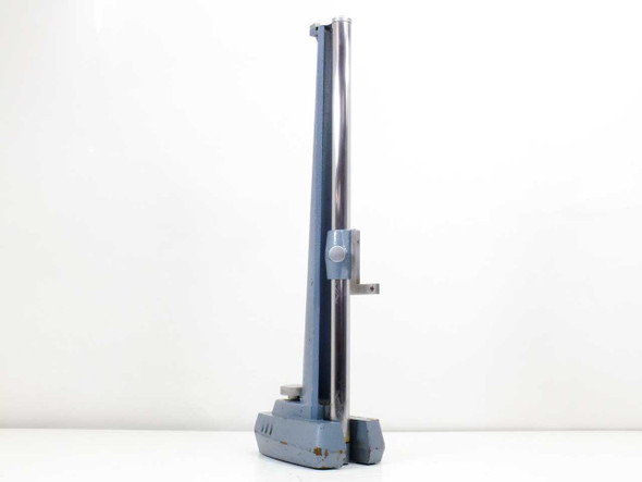 Precision microscope stand left-side profile view showing chrome vertical rail and blue cast column with sliding carriage