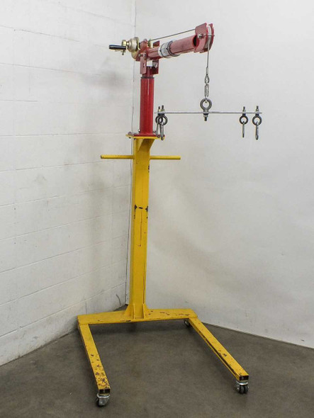 Thern 5122 Portable Davit Crane full view – yellow wheel base with red column and boom, cable and hook visible