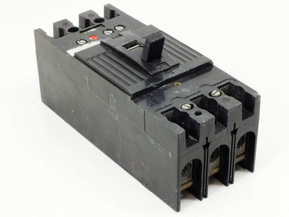 Unbranded 3-pole MCCB circuit breaker — front right angle view showing red trip indicator button and toggle handle