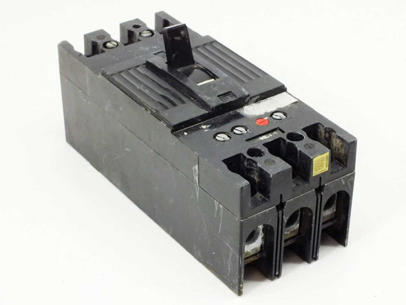 Unbranded 3-pole heavy duty molded case circuit breaker — front left angle view showing toggle handle and line terminals