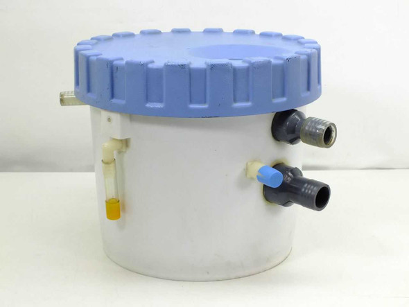 Norpak 3.5 gallon white polypropylene filter housing with blue threaded lid and side-mount valves — front view