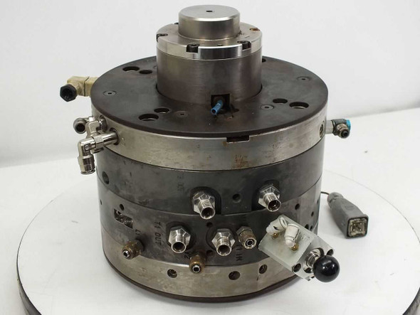 AWM Mold Tech AG Netstal DC injection mold head – front three-quarter view showing cylindrical body, top chuck, pneumatic fittings, and attached connector