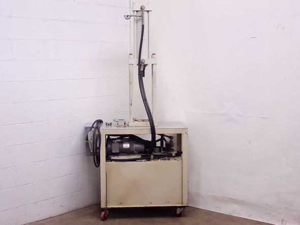 White hydraulic press full left-side view showing motor assembly on top of base cabinet and vertical press column with hydraulic line
