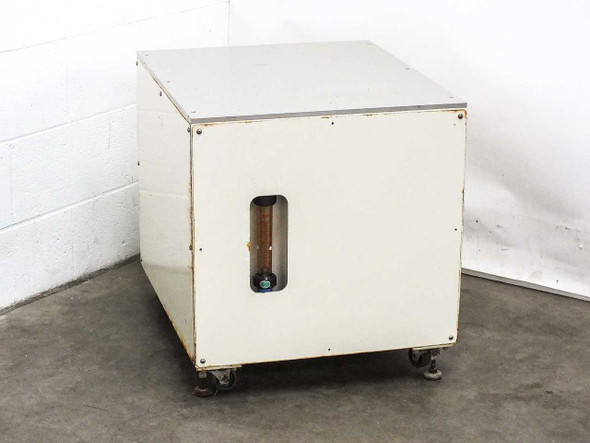Custom water filtration enclosure front view showing painted white steel cabinet on leveling feet with flowmeter window cutout on front panel