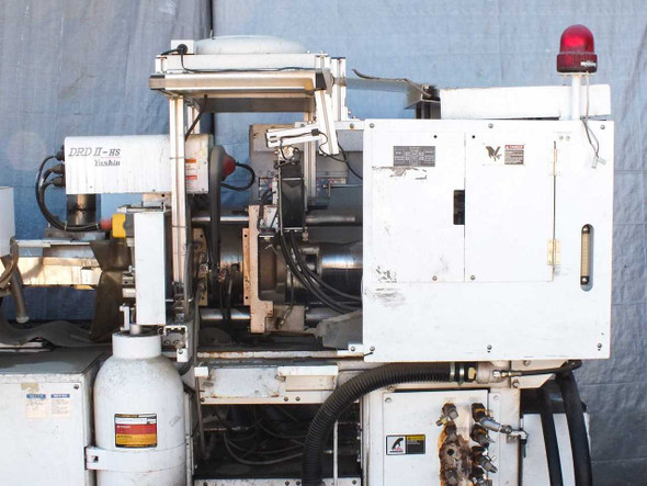 Sumitomo SD30 injection molder – right-side view with Yushin DRD II-HS robot arm visible and control cabinet