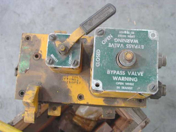 Lear Siegler Sancor 137-1001 Hydraulic Pump – top/rear view showing bypass valve assembly with Open/Closed lever and green warning label