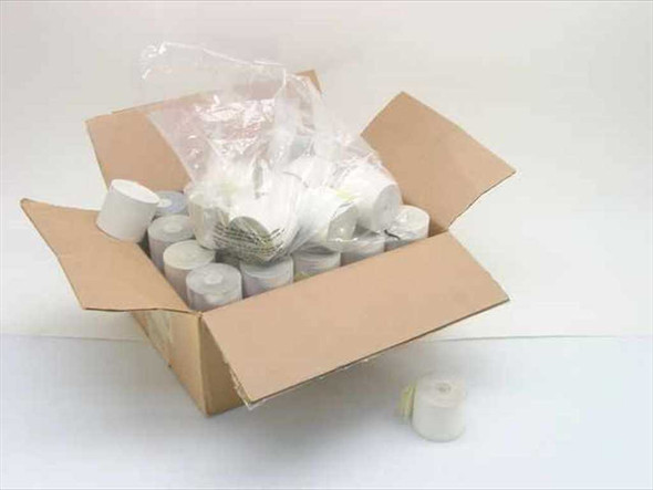 Open cardboard box containing a large lot of white 43mm impact ribbon receipt paper rolls with some rolls wrapped in plastic