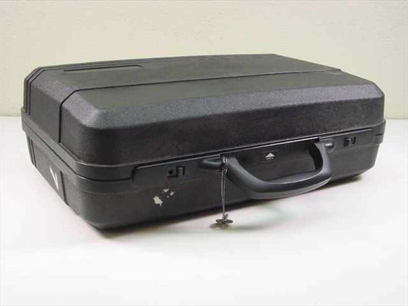 Unbranded hard shell carry case closed view showing top handle and lock with key attached on chain